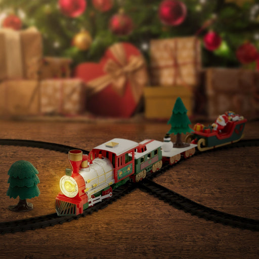 Trenino di Natale con luci sui binari sotto l'albero